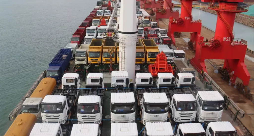 HOWO and Shacman dump trucks at Tianjin port, destined for DRC mining operations in Katanga province