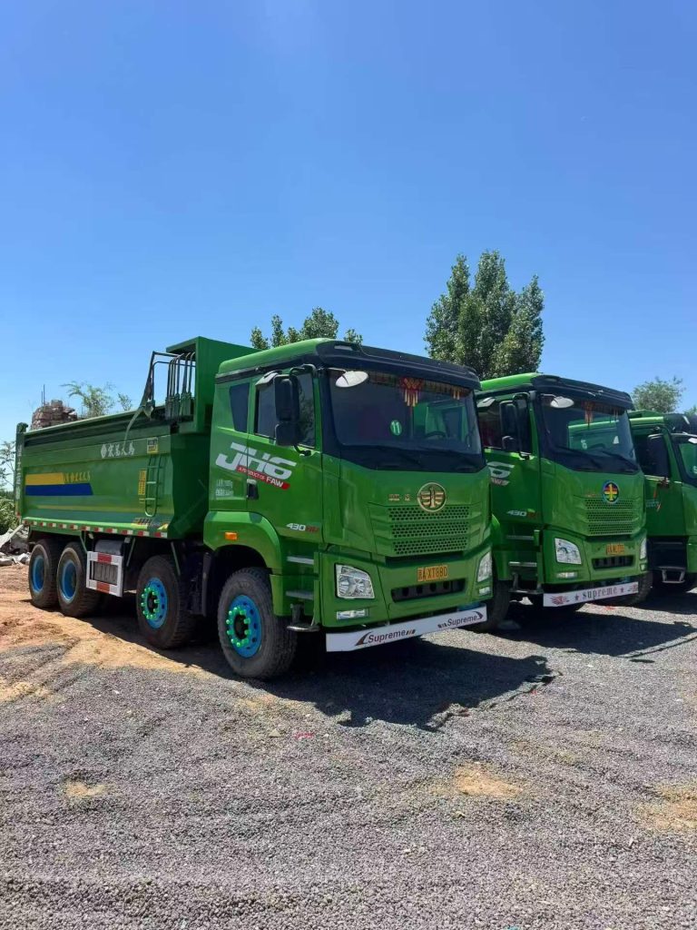 HebeiCar warehouse in Shijiazhuang China with FAW J6 trucks in stock ready for export to Africa