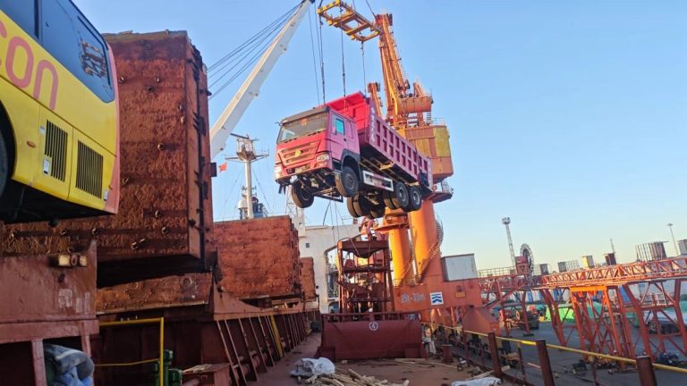 HOWO 371 dump truck secured inside RORO cargo deck during loading at Tianjin Port, China used truck export