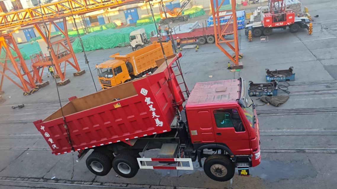 Used trucks loaded inside a RORO vessel for shipping from China to Africa. Roll-on roll-off shipping is the standard method for refrigerated trucks due to their height.