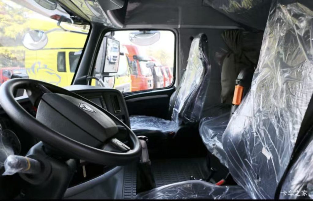 HOWO T7H high-roof sleeper cabin interior with air suspension seat